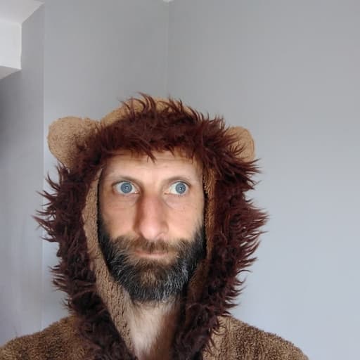 Headshot of Elliot Harris (he/him)